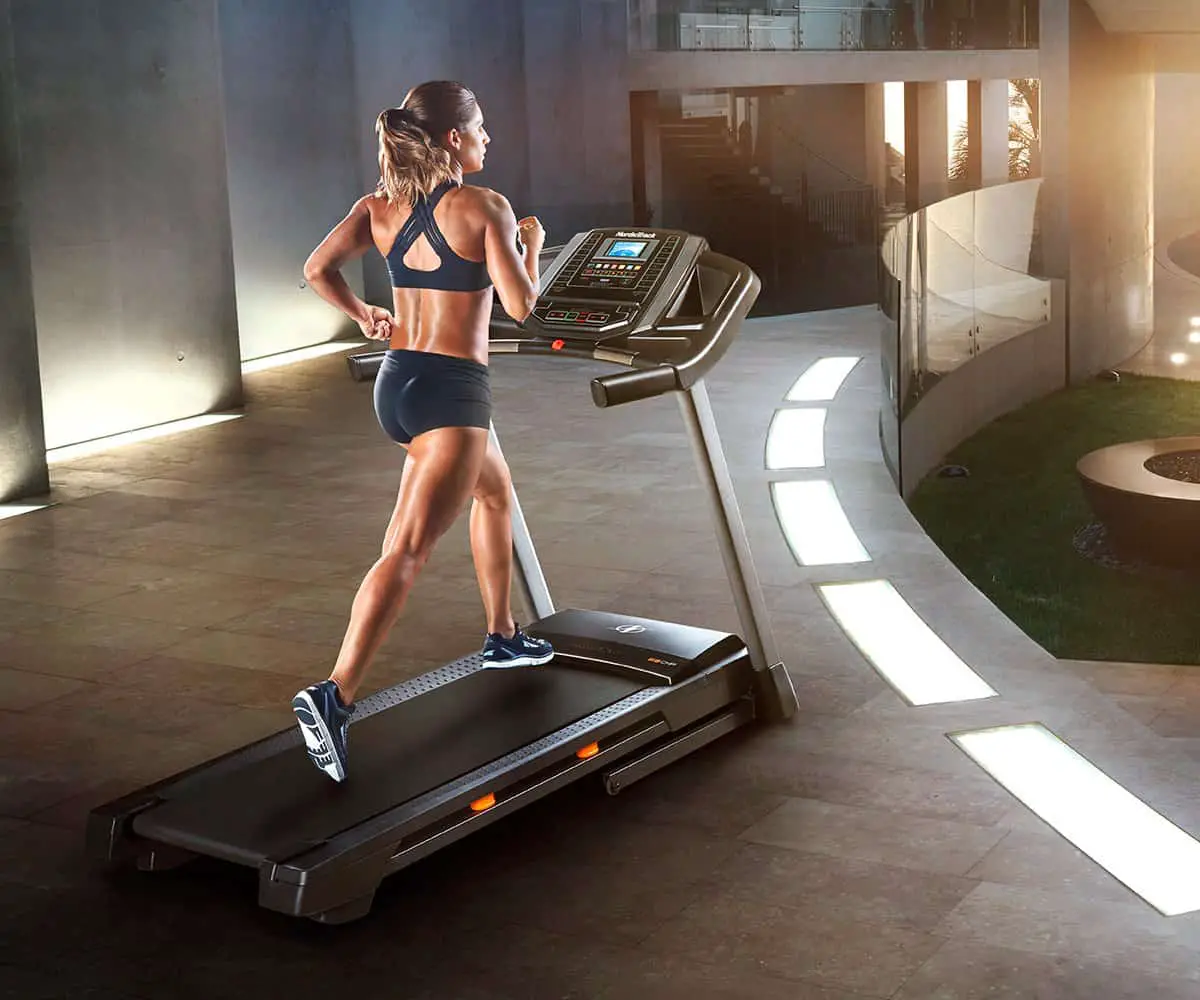 woman using the nordictrack t 6.5 s treadmill