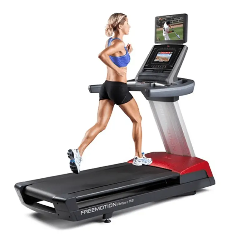 Woman wearing a blue sports bra and black shorts while running in a FreeMotion Reflex t11.8 Treadmill