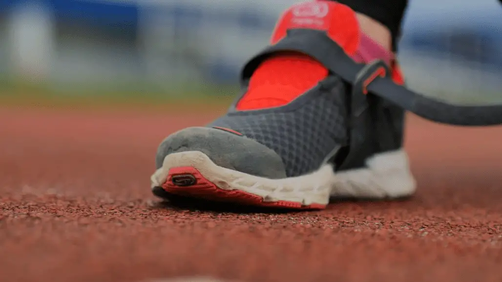 Grayish with red colored best workout shoes for treadmill