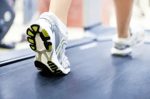 White shoes with yellow and black color in a treadmill