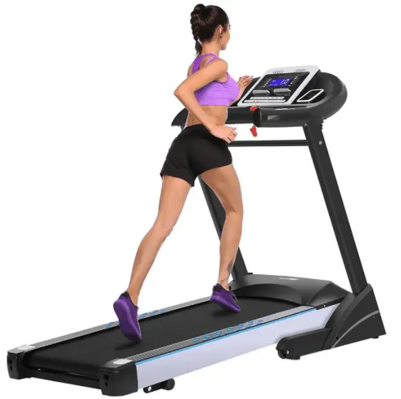 Girl wearing a pink top and running in a treadmill